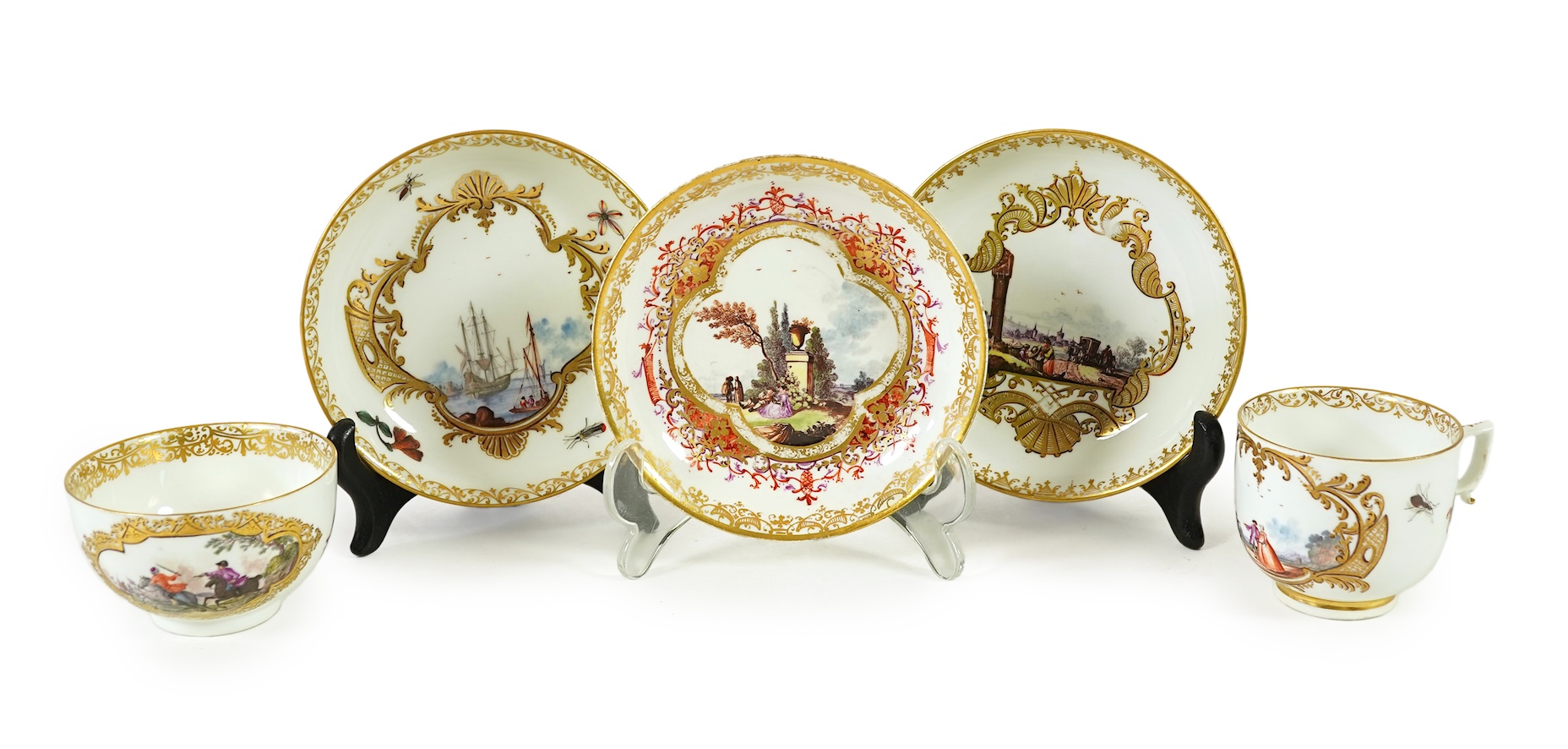 A Meissen cup and saucer, similar tea bowl and two saucers, c.1735-45